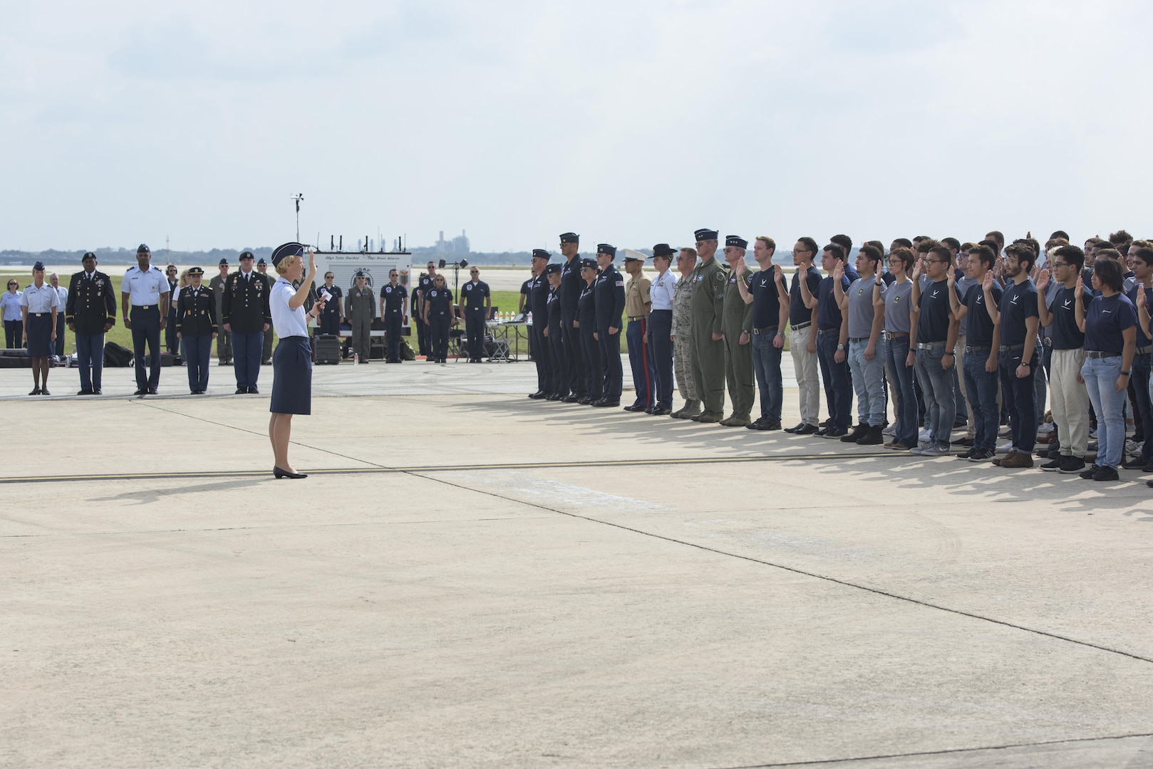 Brig. Gen. Heather Pringle, 502nd Air Base Wing and Joint Base San Antonio commander, issues the Oath of Enlistment to new men and women joining the Army, Air Force, Navy, Marine Corps and Coast Guard during the JBSA Air Show and Open House Nov. 4, 2017, at JBSA-Lackland, Kelly Field. Air Shows allow the Air Force to display the capapbilities of our aircraft to the American Public through aerial demonstration and static displays.