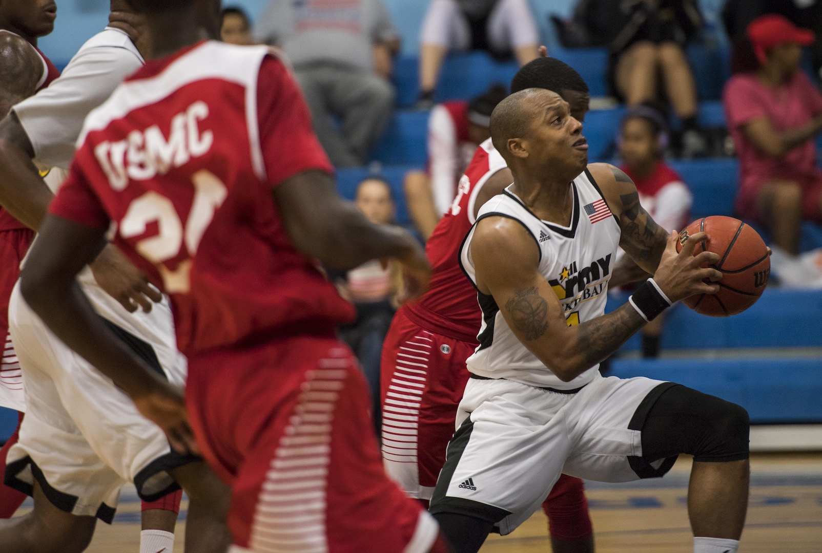 SAN ANTONIO (Nov. 04, 2017) - U.S. Navy Petty Officer 3rd Class Marquel  Delancey assigned to Atlantic Area CMD Center, attempts to score during a  basketball game. The 2017 Armed Forces Basketball