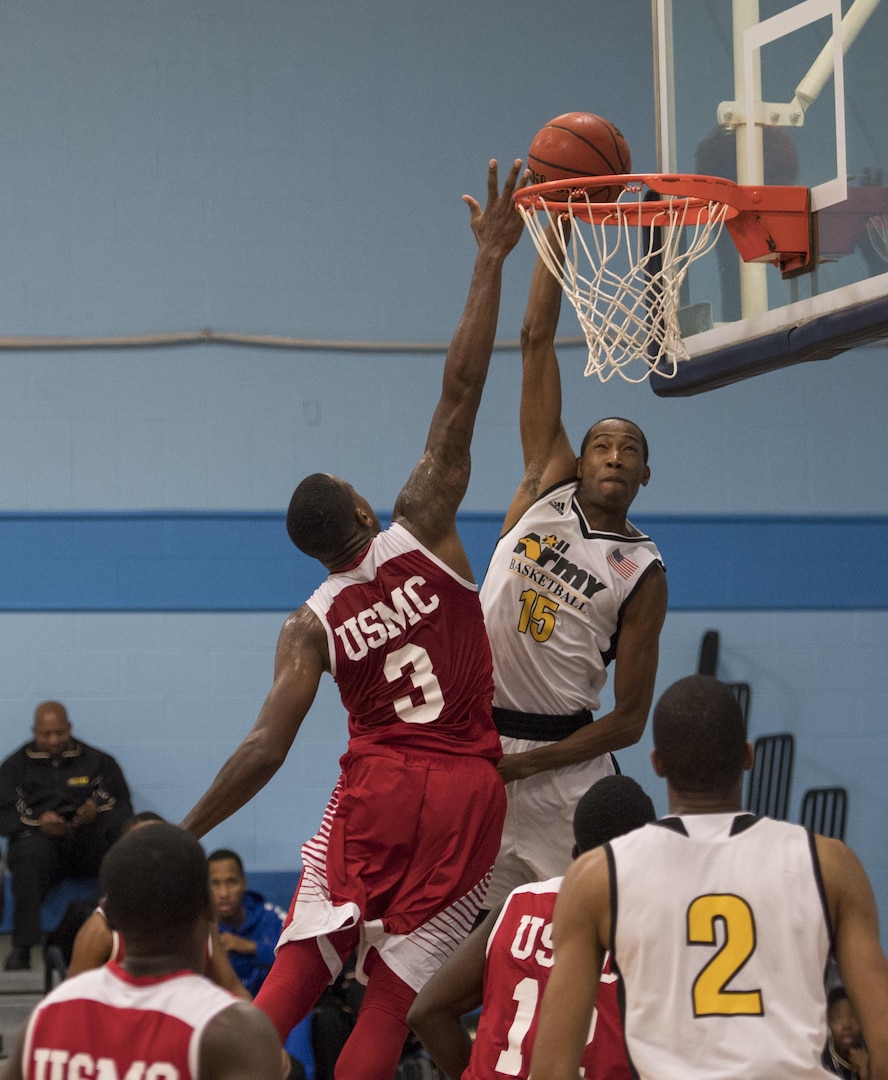 SAN ANTONIO (Nov. 04, 2017) - U.S. Army Sgt. Jamaal Thomas, assigned to Walter Reed National Military Medical Center, dunks the ball during a basketball game. The 2017 Armed Forces Basketball Championship is held at Joint Base San Antonio, Lackland Air Force Base from 1-7 November. The best two teams during the double round robin will face each other for the 2017 Armed Forces crown. (U.S. Navy photo by Mass Communication Specialist 2nd Class Emiline L. M. Senn/Released)