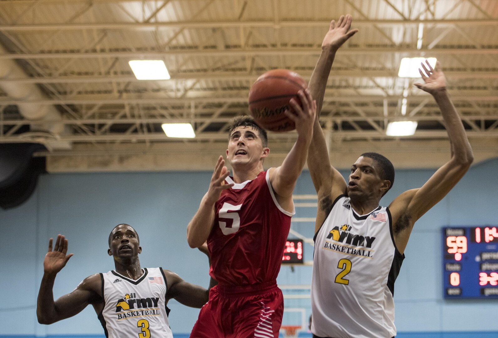 SAN ANTONIO (Nov. 04, 2017) - U.S. Marine Corps 1st Lt. Kevin Alter, assigned to Marine Corps Air Station Miramar, attempts to make a layup during a basketball game. The 2017 Armed Forces Basketball Championship is held at Joint Base San Antonio, Lackland Air Force Base from 1-7 November. The best two teams during the double round robin will face each other for the 2017 Armed Forces crown. (U.S. Navy photo by Mass Communication Specialist 2nd Class Emiline L. M. Senn/Released)