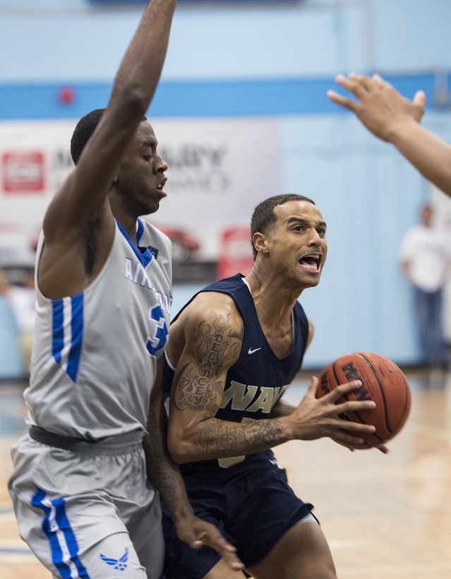 SAN ANTONIO (Nov. 04, 2017) - U.S. Navy Petty Officer 3rd Class Marquel Delancey assigned to Atlantic Area CMD Center, attempts to score during a basketball game. The 2017 Armed Forces Basketball Championship is held at Joint Base San Antonio, Lackland Air Force Base from 1-7 November. The best two teams during the double round robin will face each other for the 2017 Armed Forces crown. (U.S. Navy photo by Mass Communication Specialist 2nd Class Emiline L. M. Senn/Released)