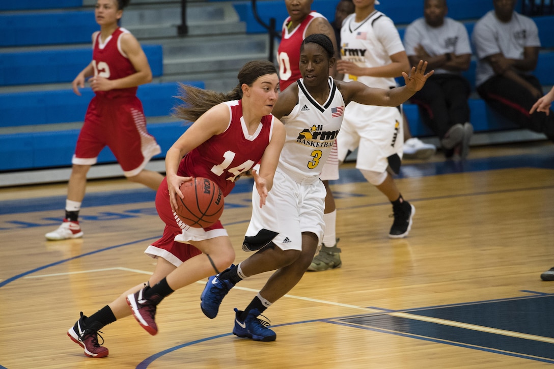 SAN ANTONIO (Nov. 04, 2017) - U.S. Marine Corps Cpl. Sireniti Castillo, assigned to MCB Camp Pendleton, Calif., drives down the court during a basketball game. The 2017 Armed Forces Basketball Championship is held at Joint Base San Antonio, Lackland Air Force Base from 1-7 November. The best two teams during the double round robin will face each other for the 2017 Armed Forces crown. (U.S. Navy photo by Mass Communication Specialist 2nd Class Christopher Frost/Released)