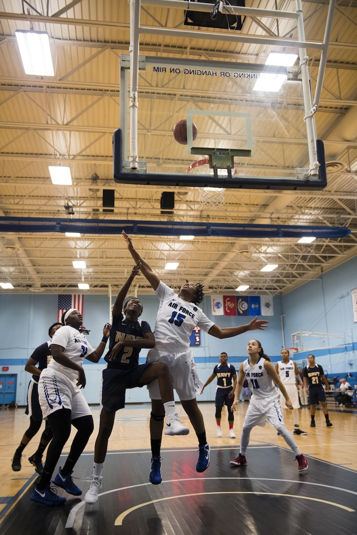 SAN ANTONIO (Nov. 04, 2017) - U.S. Navy Petty Officer 2nd Class Kristina Farmer, assigned to Navy Information Operations Command, Ga., attempts a layup during a basketball game. The 2017 Armed Forces Basketball Championship is held at Joint Base San Antonio, Lackland Air Force Base from 1-7 November. The best two teams during the double round robin will face each other for the 2017 Armed Forces crown. (U.S. Navy photo by Mass Communication Specialist 2nd Class Christopher Frost/Released)