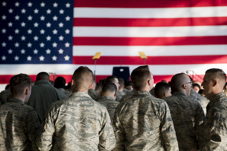 Airmen with the 374th Airlift Squadron wait and watch for the arrival of President Donald J. Trump, before a Troop Talk, Nov. 5, 2017, at Yokota Air Base, Japan.