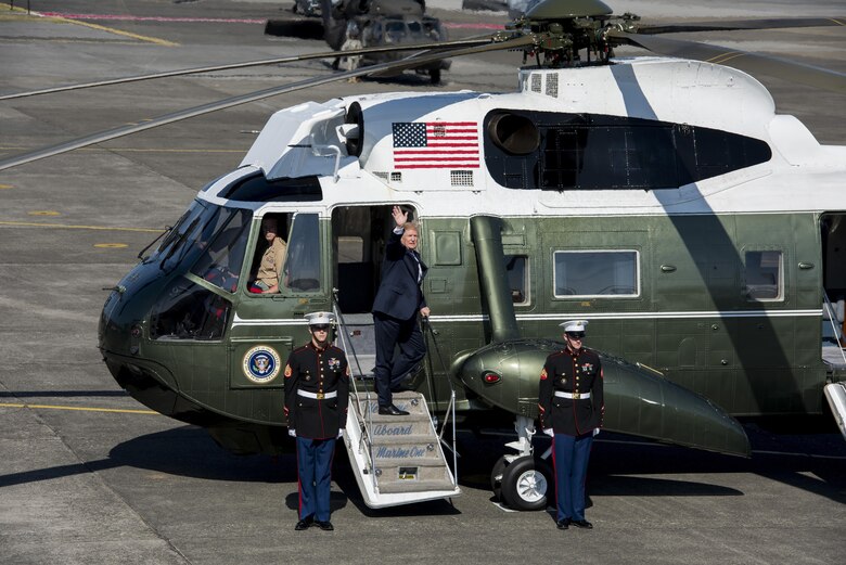 President Donald J. Trump waves good-buy as he boards Marine One after a Troop Talk, Nov. 5, 2017, at Yokota Air Base, Japan.