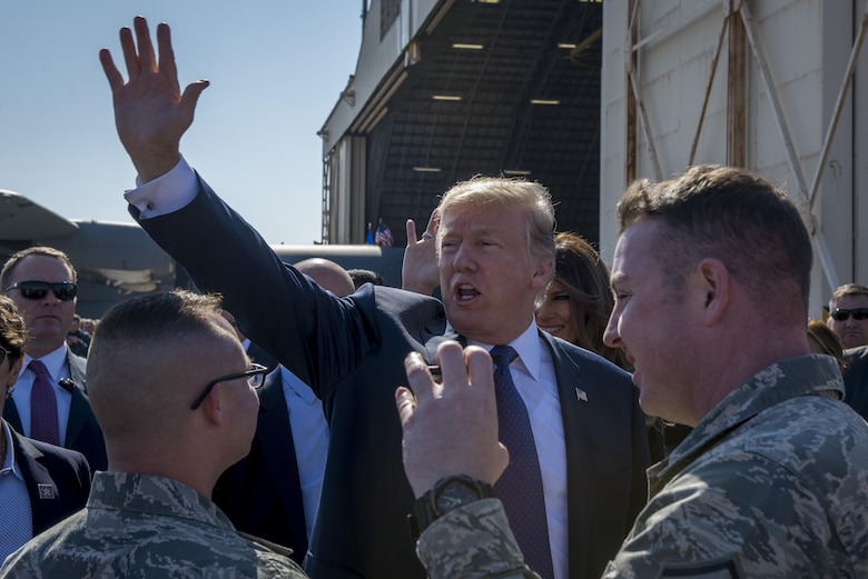 President Donald J. Trump waves to service members and their families upon arriving to Japan, Nov. 5, 2017, at Yokota Air Base, Japan.