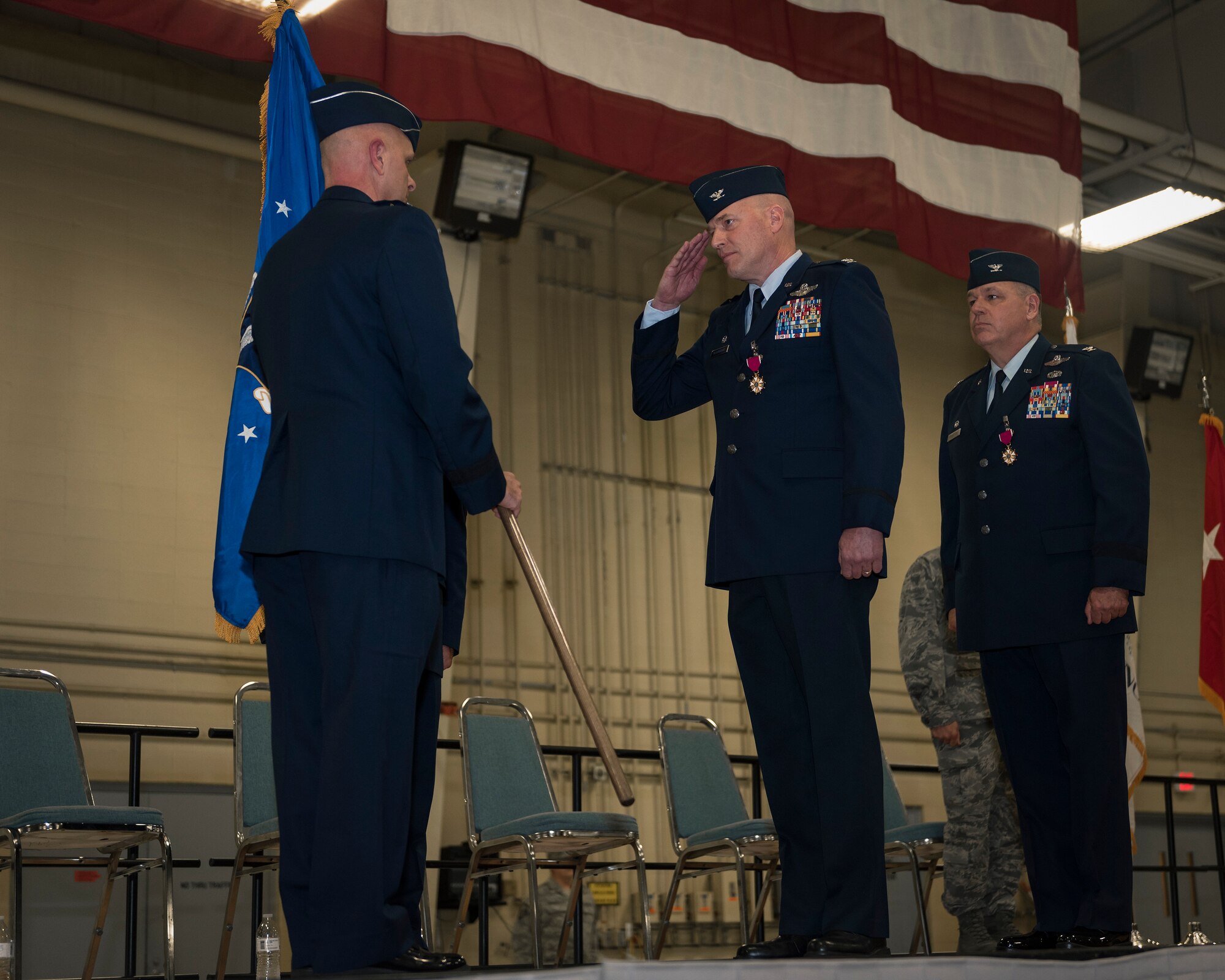 U.S. Air Force Col. Daniel McDonough, center, receives command of the 182nd Airlift Wing, Illinois Air national Guard, from Maj. Gen. Ron Paul, the assistant adjutant general – Air of the Illinois National Guard, during a change of command in Peoria, Ill., Nov. 4, 2017. McDonough replaced Col. William Robertson, right, who became the chief of staff for the Illinois Air National Guard upon his promotion to brigadier general during the ceremony. (U.S. Air National Guard photo by Tech. Sgt. Lealan Buehrer)