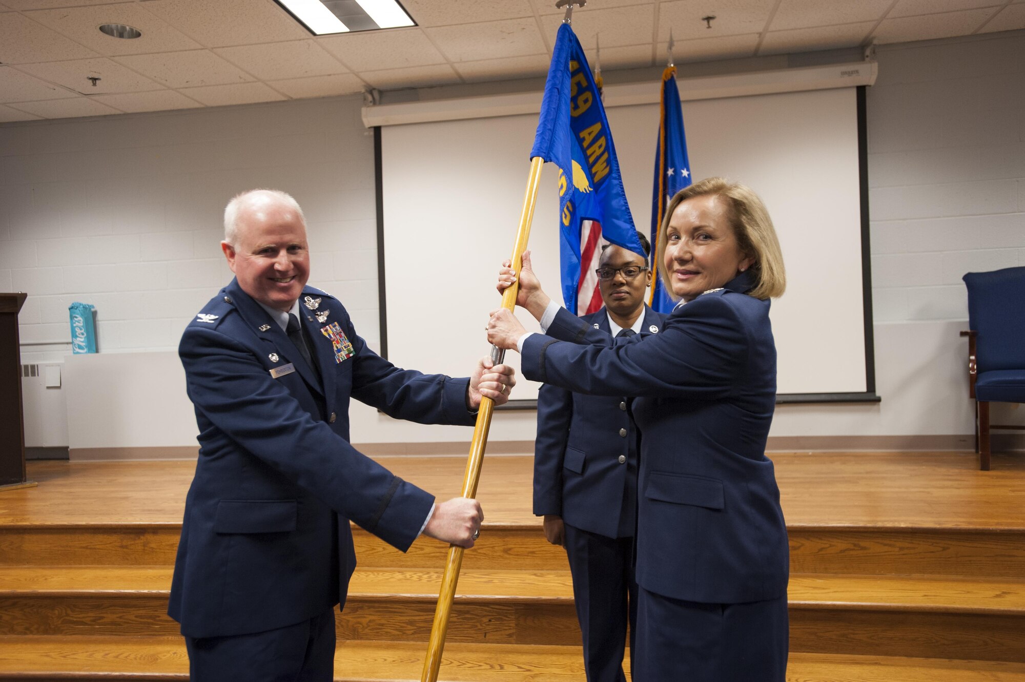 Col. Thomas Pemberton, commander of the 459th Operations Group and Col. Linda Lindberg, commander of the 459th Aeromedical Evacuation Squadron, pose for a picture during a change of command ceremony at Joint Base Andrews, Md., Nov. 5, 2017. Lindberg assumed command of the 459 AES and is joining the unit from the 349 AES at Travis Air Force Base, Calif. (U.S. Air Force photo by Senior Airman Andreaa Phillips)