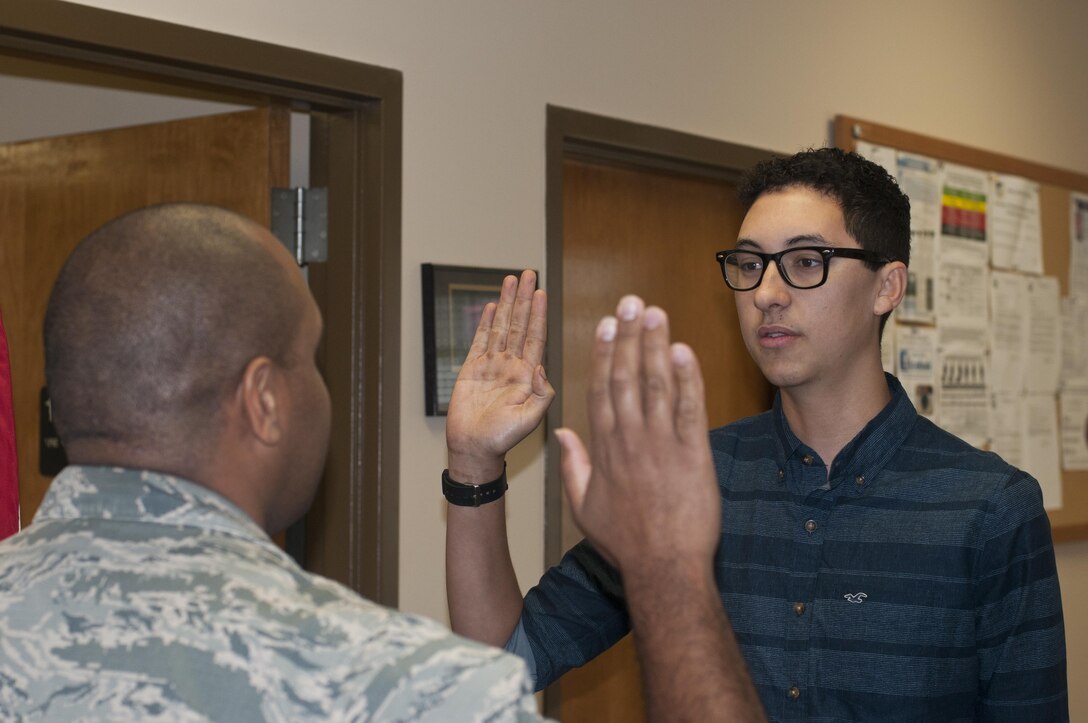 U.S. Air Force Capt. William Mojica, 916th Air Refueling Wing public affairs officer, gives the oath of enlistment at Seymour Johnson Air Force Base, N.C., Nov. 4, 2017. All Airmen take the oath of enlistment upon entering into service. (U.S. Air Force photo by Senior Airman Kayla Newman)