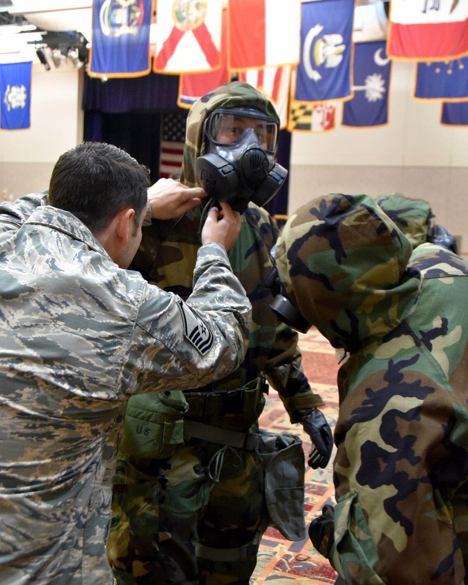 Master Sgt. Jeremy Whitley, 22nd Civil Engineer Squadron Emergency Management superintendent makes adjustments on the Mission Oriented Protective Posture for a group of 931st Air Refueling Wing Airmen Nov. 5, 2017, McConnell Air Force Base, Kan.  Airmen participated in Chemical, Biological, Radiological, Nuclear, and Explosives training during the November Unit Training Assembly.