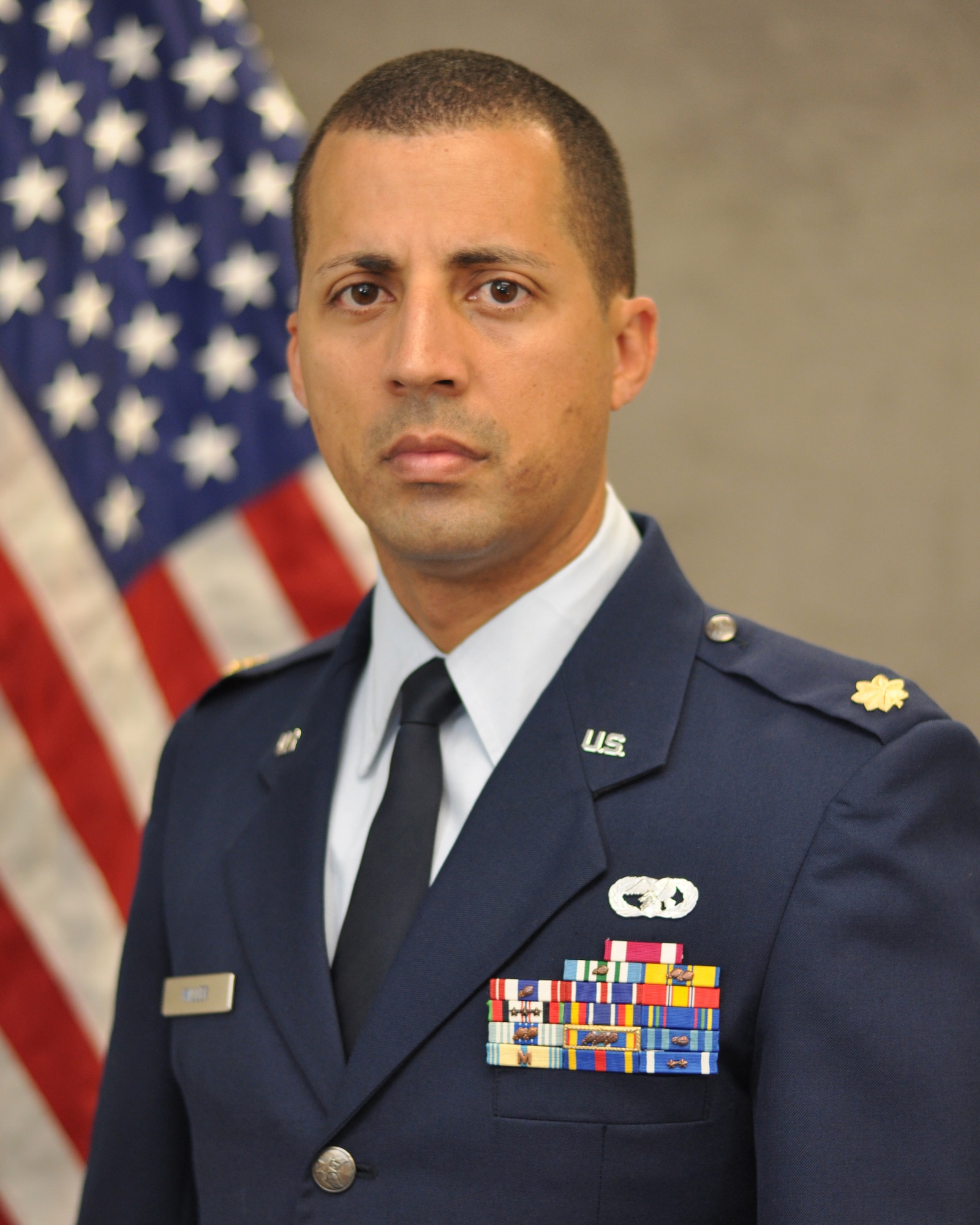 Maj. Damien Miller, 507th Logistics Readiness Squadron commander poses for his official photo here June 15, 2017. (U.S. Air Force Photo)