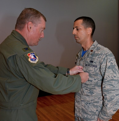 Maj. Damien Miller, 507th Logistics Readiness Squadron commander, receives the Bronze Star Medal from Col. Doug Gullion, 507th Air Refueling Wing commander, during a medal presentation here, Nov. 5, 2017. Miller received the medal for meritorious service in Iraq from Jan. 7 to July 8, 2017, while serving as the 442nd Air Expeditionary Squadron commander. Miller commanded all six coalition aerial ports within Iraq to transport 33,600 tons of cargo and 37,800 passengers on more than 4,500 missions. (U.S. Air Force Photo/Tech Sgt. Samantha Mathison)