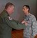 Maj. Damien Miller, 507th Logistics Readiness Squadron commander, receives the Bronze Star Medal from Col. Doug Gullion, 507th Air Refueling Wing commander, during a medal presentation here, Nov. 5, 2017. Miller received the medal for meritorious service in Iraq from Jan. 7 to July 8, 2017, while serving as the 442nd Air Expeditionary Squadron commander. Miller commanded all six coalition aerial ports within Iraq to transport 33,600 tons of cargo and 37,800 passengers on more than 4,500 missions. (U.S. Air Force Photo/Tech Sgt. Samantha Mathison)