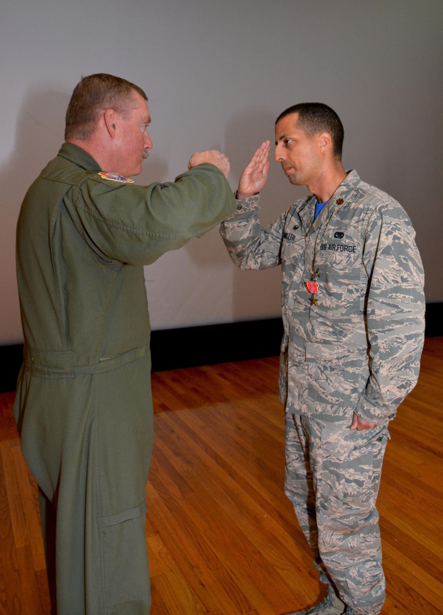Maj. Damien Miller, 507th Logistics Readiness Squadron commander, receives the Bronze Star Medal from Col. Doug Gullion, 507th Air Refueling Wing commander, during a medal presentation here, Nov. 5, 2017. Miller received the medal for meritorious service in Iraq from Jan. 7 to July 8, 2017, while serving as the 442nd Air Expeditionary Squadron commander. Miller commanded all six coalition aerial ports within Iraq to transport 33,600 tons of cargo and 37,800 passengers on more than 4,500 missions. (U.S. Air Force Photo/Tech Sgt. Samantha Mathison)