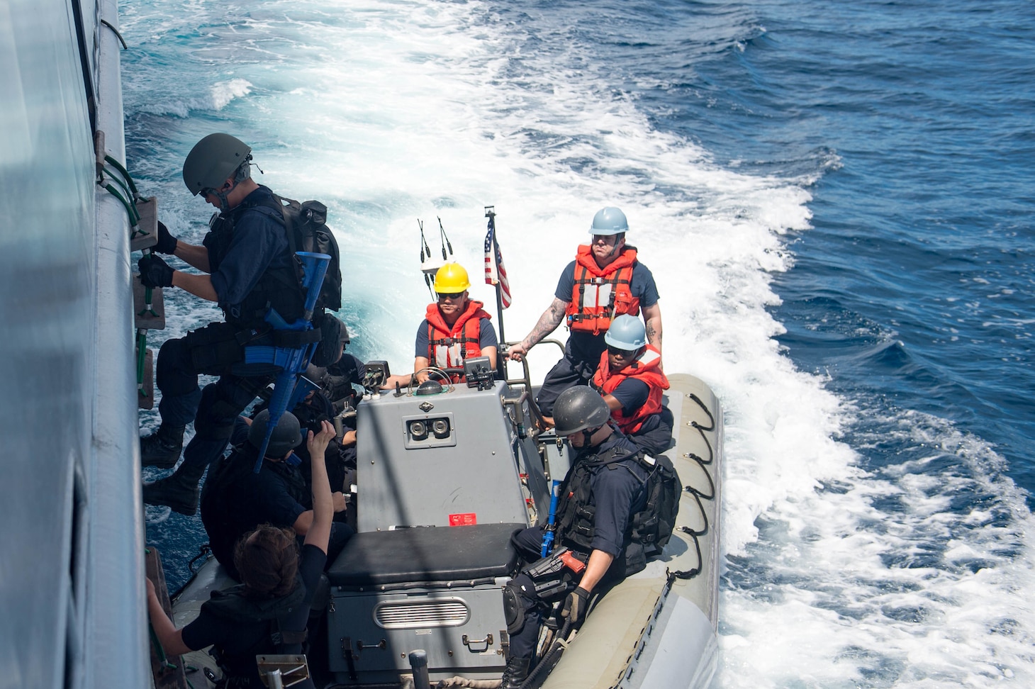 SOUTH CHINA SEA (Nov. 17, 2016) A Sailor assigned to the forward-deployed Arliegh Burke-class guided-missile destroyer USS McCampbell (DDG 85) disembarks the Royal Brunei Navy ship KDB Darussalam to a rigid hull inflatable boat (RHIB) during a visit, board, search and seizure (VBSS) training exercise during Cooperation Afloat Readiness and Training (CARAT) 2016.  CARAT is a series of annual maritime exercises between the U.S. Navy, U.S. Marine Corps and the armed forces of nine partner nations to include Bangladesh, Brunei, Cambodia, Indonesia, Malaysia, the Philippines, Singapore, Thailand, and Timor-Leste.