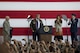 President Donald J. Trump puts on a flight jacket during a Troop Talk, Nov. 5, 2017, at Yokota Air Base, Japan.