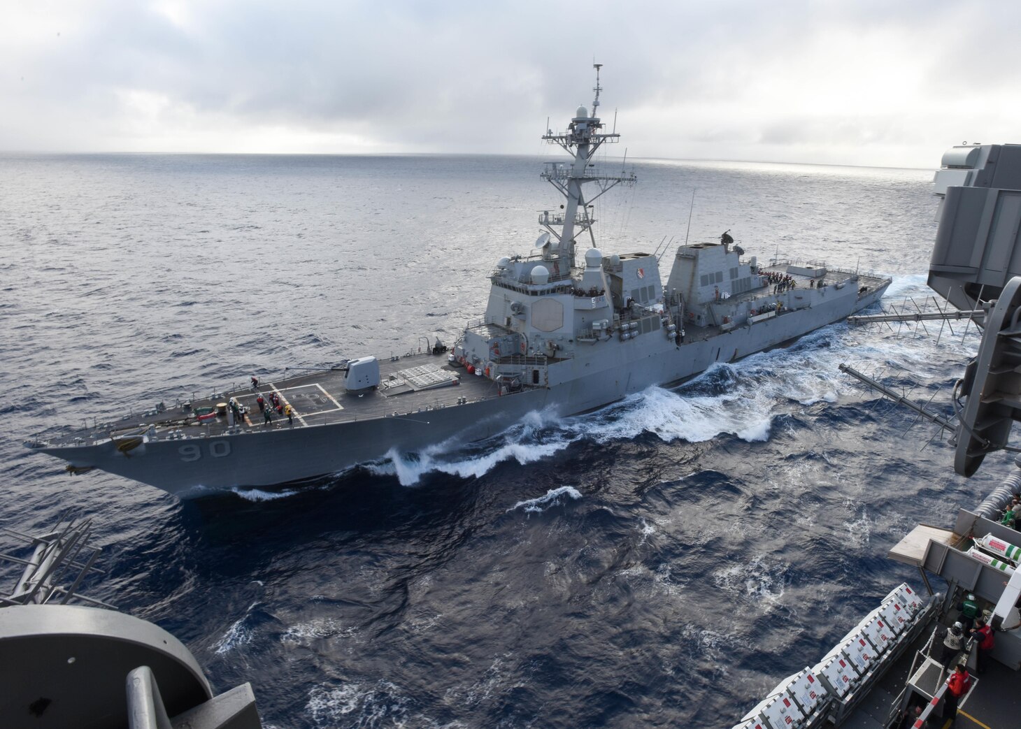 The Arleigh Burke-class guided-missile destroyer USS Chafee (DDG 90) pulls alongside the aircraft carrier USS Nimitz (CVN 68) for a scheduled replenishment-at-sea. Nimitz is underway to complete flight deck certification and carrier qualifications for an upcoming 2017 deployment.