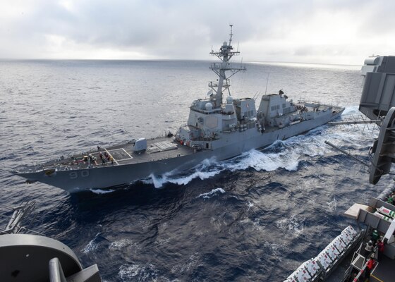The Arleigh Burke-class guided-missile destroyer USS Chafee (DDG 90) pulls alongside the aircraft carrier USS Nimitz (CVN 68) for a scheduled replenishment-at-sea. Nimitz is underway to complete flight deck certification and carrier qualifications for an upcoming 2017 deployment.