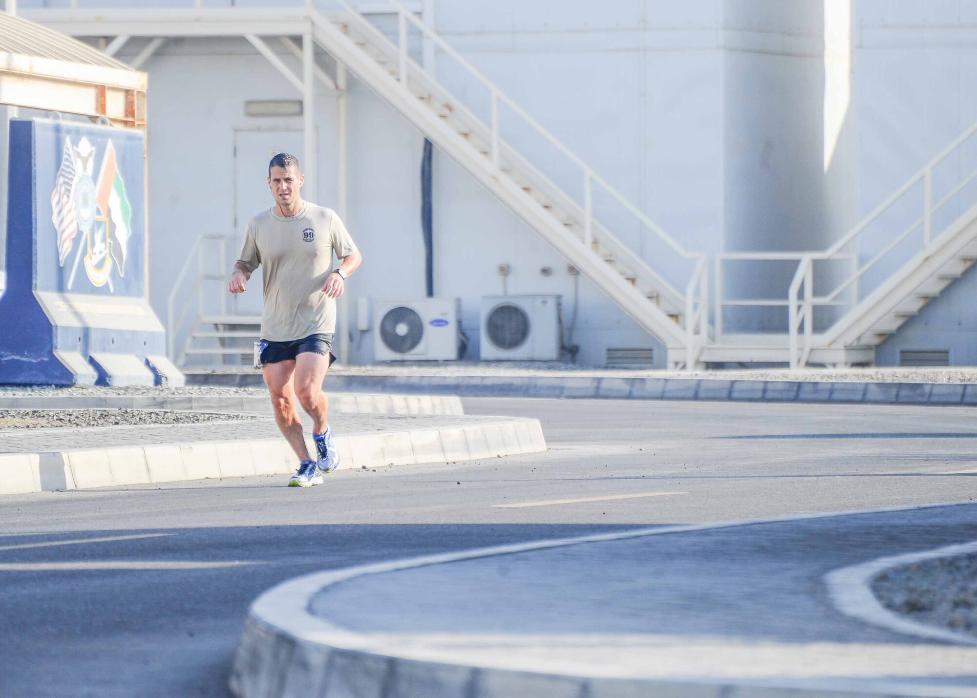 Military service members participating in the 42nd Annual U.S. Marine Corps Marathon-Forward take off from the starting line at at Al Dhafra Air Base, United Arab Emirates. Oct. 28, 2017. The official marathon, which was held in Virginia and Washington D.C., began in October 1975 and has grown to be the fourth largest marathon in the U.S. and the ninth largest in the world attracting upwards of twenty thousand runners each year. (U.S. Air Force photo by Staff Sgt. Colton Elliott)