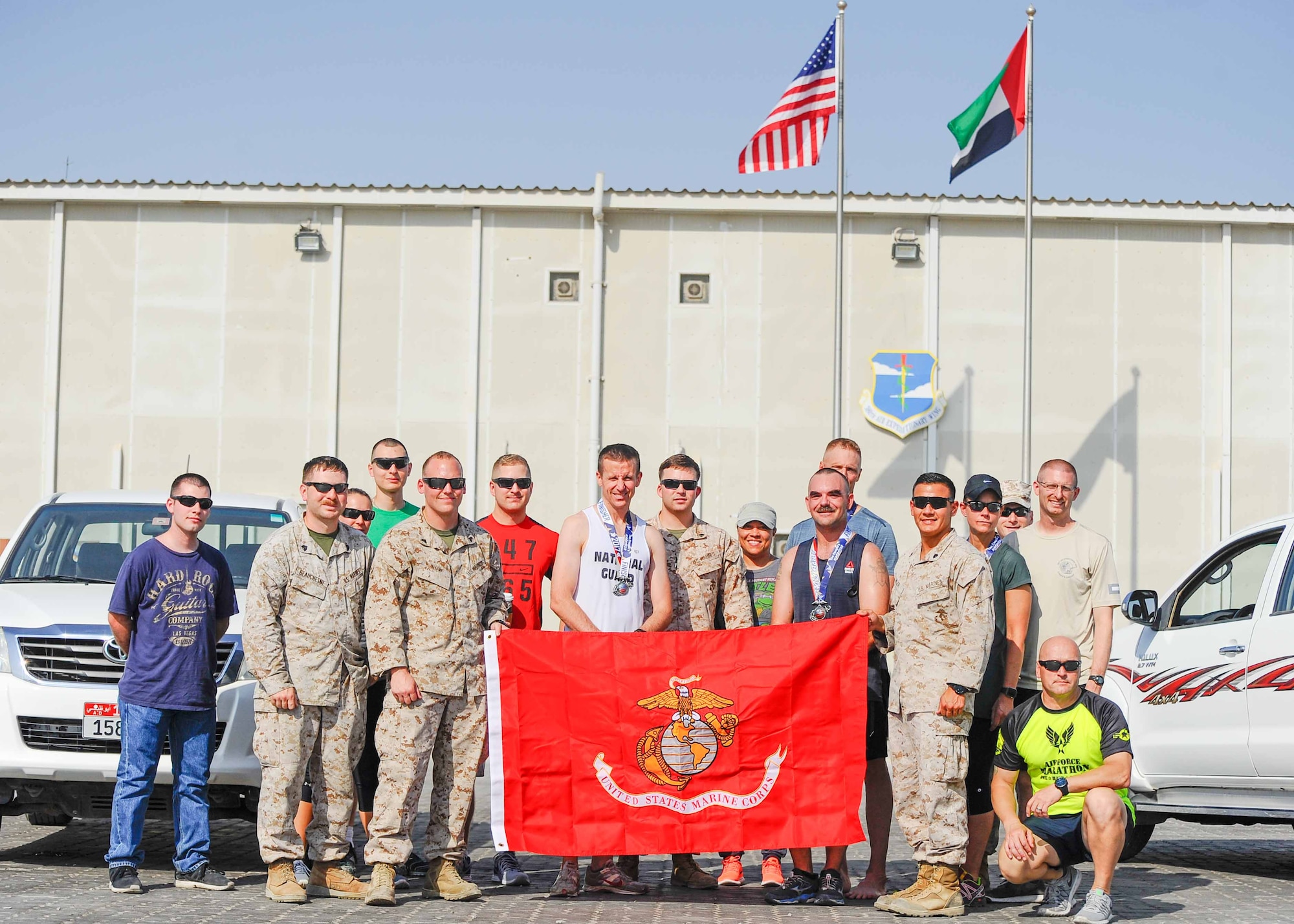 Military service members participating in the 42nd Annual U.S. Marine Corps Marathon-Forward take off from the starting line at at Al Dhafra Air Base, United Arab Emirates. Oct. 28, 2017. The official marathon, which was held in Virginia and Washington D.C., began in October 1975 and has grown to be the fourth largest marathon in the U.S. and the ninth largest in the world attracting upwards of twenty thousand runners each year. (U.S. Air Force photo by Staff Sgt. Colton Elliott)