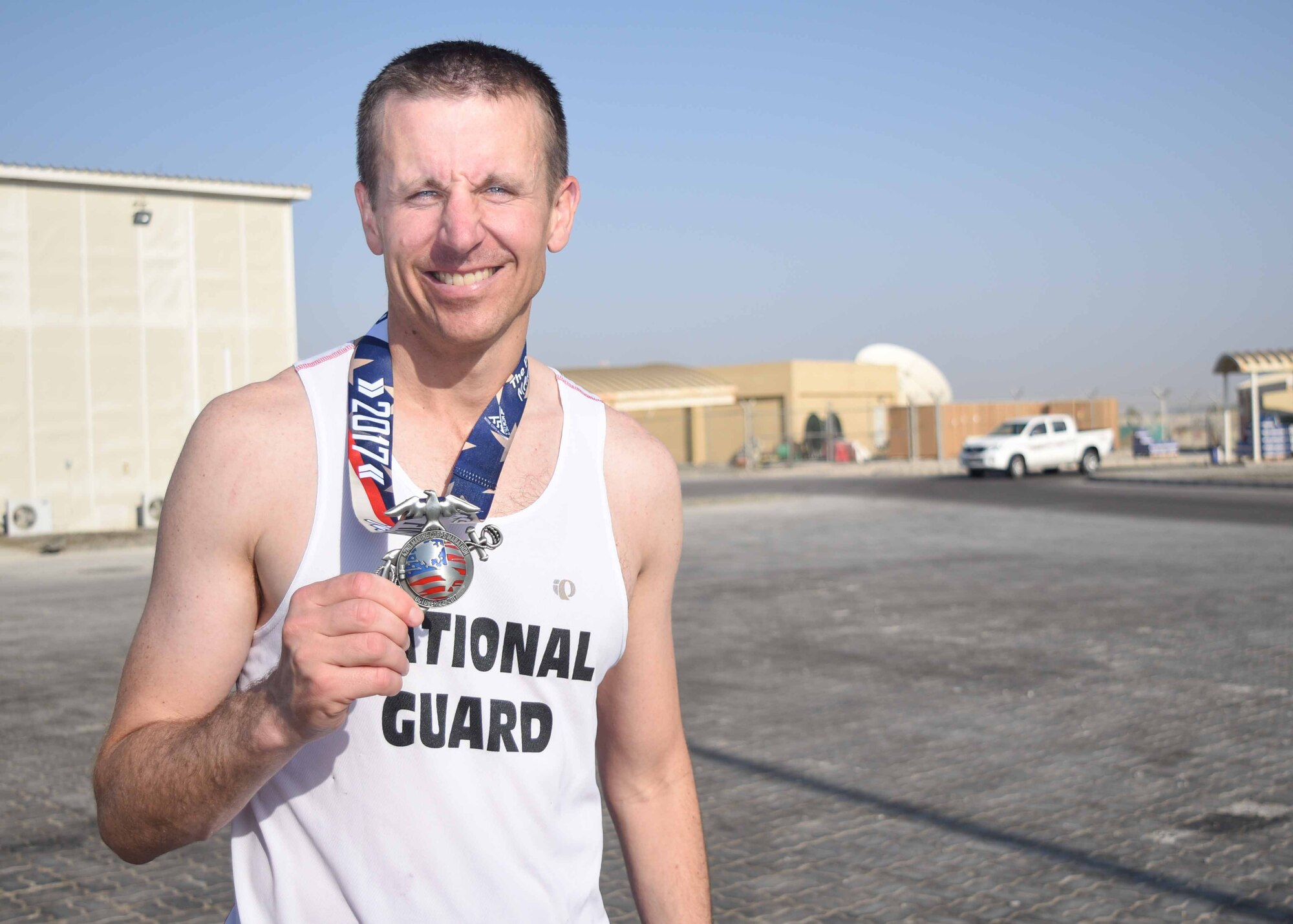 Military service members participating in the 42nd Annual U.S. Marine Corps Marathon-Forward take off from the starting line at at Al Dhafra Air Base, United Arab Emirates. Oct. 28, 2017. The official marathon, which was held in Virginia and Washington D.C., began in October 1975 and has grown to be the fourth largest marathon in the U.S. and the ninth largest in the world attracting upwards of twenty thousand runners each year. (U.S. Air Force photo by Staff Sgt. Colton Elliott)