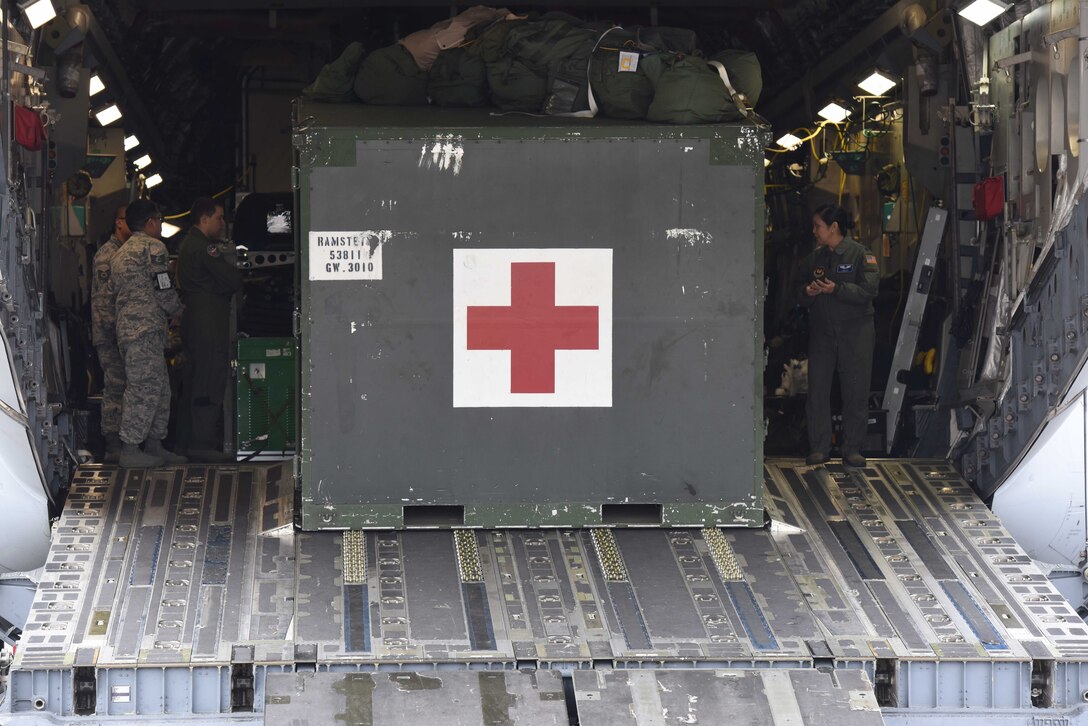 Deployed U.S. Airmen assigned to the 10th Expeditionary Aeromedical Evacuation Squadron, and the 86th Aeromedical Evacuation Squadron prepare for the arrival of injured service members on the Ramstein Air Base, Germany, Oct. 26, 2017. The two squadrons are responsible for patient safety and upkeep while traveling from Europe to the U.S.
