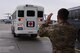 A volunteer for the En-route Patient Staging program helps guide a medical bus on the flightline on Ramstein Air Base, Germany, Oct. 26, 2017. Patients remain on the bus until accommodations on the plane are ideal for travel.