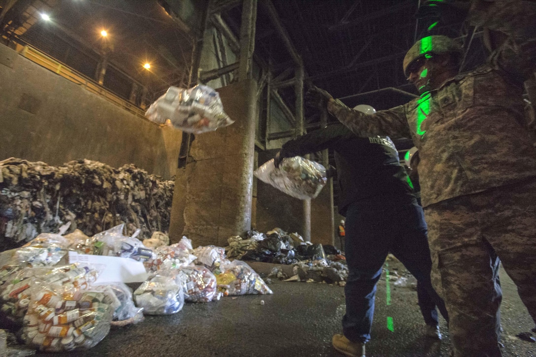 Drug Enforcement Administration agents and soldiers dumped prescription drugs to be incinerated at the Covanta Essex Resource Recovery Facility.