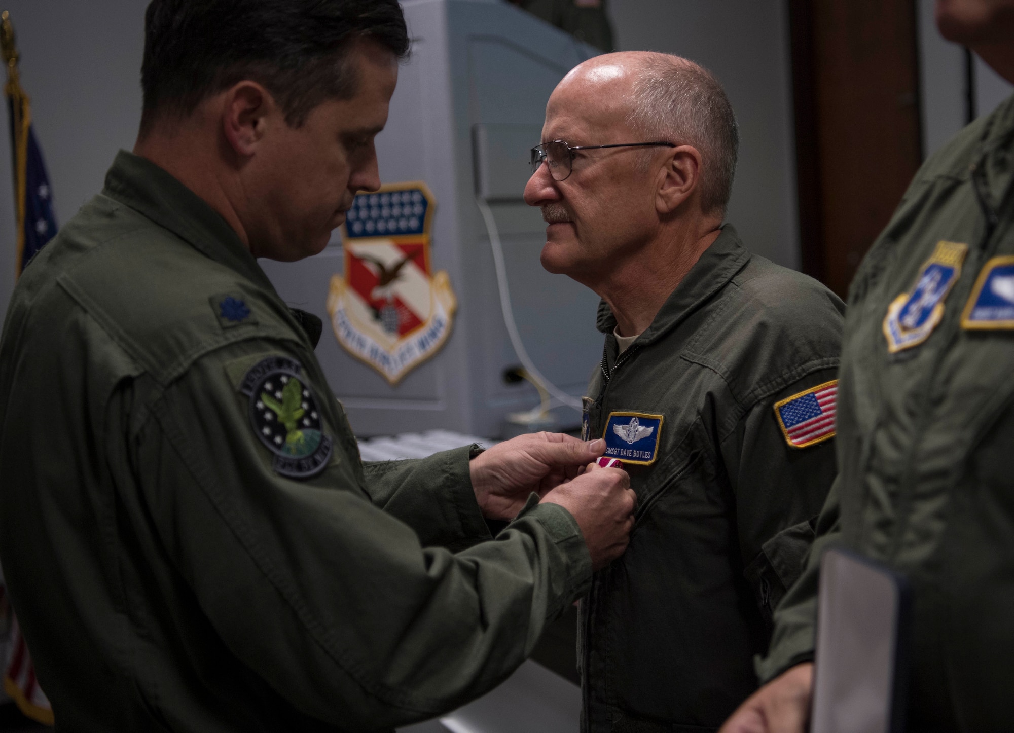 Chief Master Sgt. Dave Boyles receives an award for service during a retirement ceremony held in his honor Nov. 4, 2017 at McLaughlin Air National Guard Base, Charleston, W.Va.