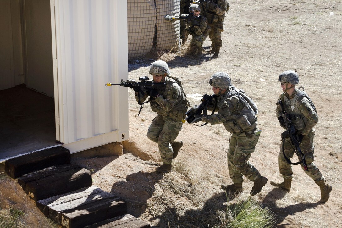 Soldiers clear a building at a military operations in urban terrain site during exercise Vigilant Shield at White Sands Missile Range, N.M.