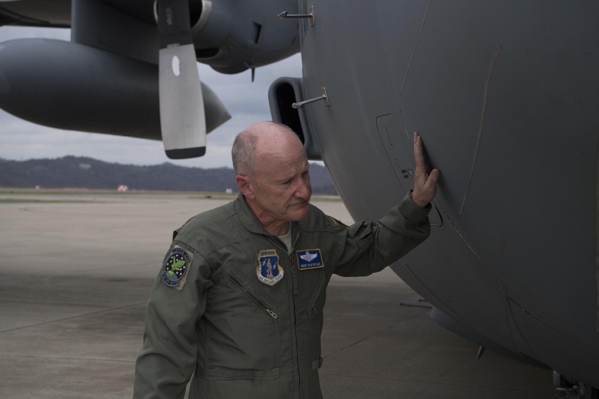 Chief Master Sgt. Dave Boyles, a 130th Airlift Wing loadmaster supervisor with more than 10,000 flying hours, says one last goodbye to the C-130H after his final flight Nov. 3, 2017 at McLaughlin Air National Guard Base, Charleston, W.Va.