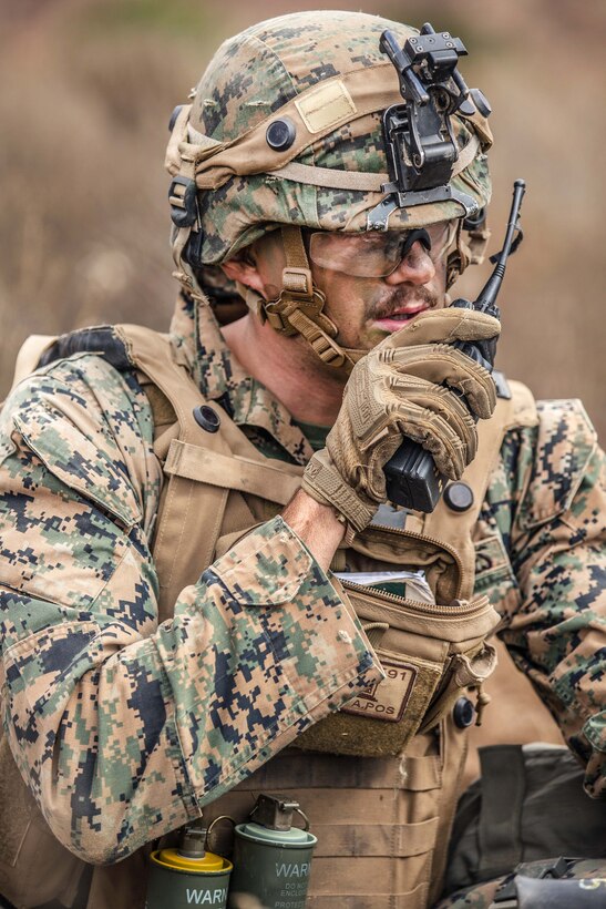 Marine Corps Cpl. Austin Leigh communicates via radio with members of his squad during a mock patrol, a part of a Sapper Leaders Course at Camp Pendleton, Calif.