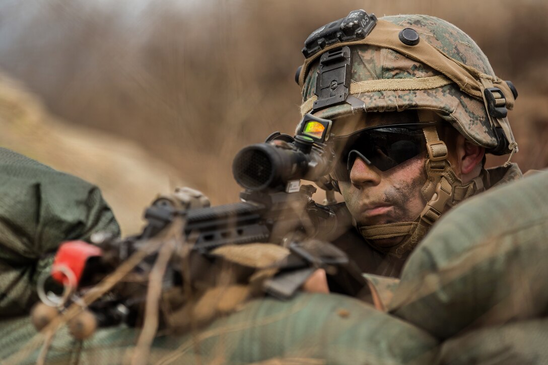 Marine Corps Cpl. Kade Ritsema scans the terrain during a mock patrol as part of a Sapper Leaders Course at Camp Pendleton, Calif.