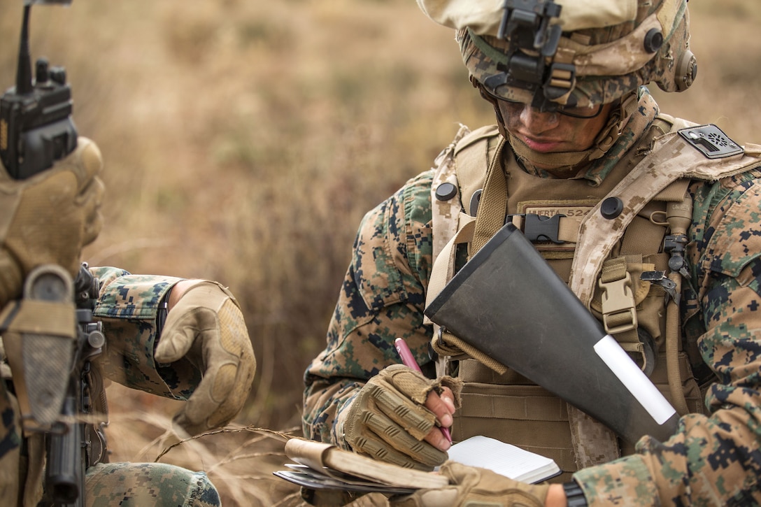 Marine Corps Rudy Huerta logs an unexploded ordnance report during a military operation on urban terrain exercise part of a Sapper Leaders Course on Camp Pendleton, Calif.