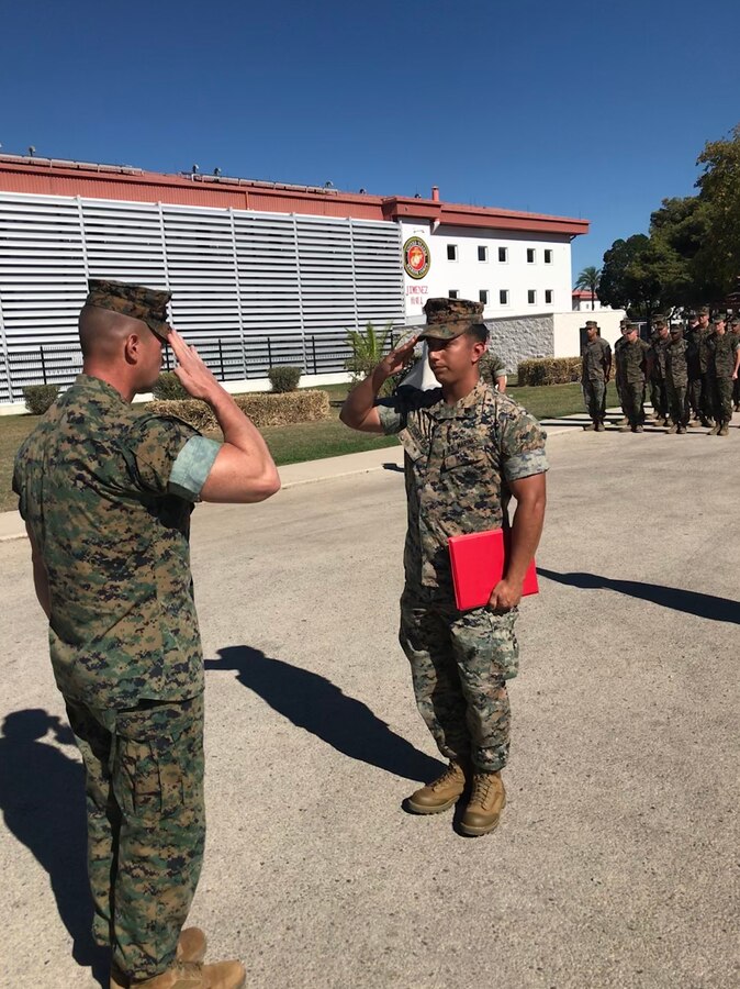 Sgt. Rene Puga-Perea, platoon guide, 2nd platoon, Charlie Co., Fleet Anti-terrorism Security Team, Europe, receives the Navy and Marine Corps Achievement Medal for outstanding performance at Naval Station Rota, Spain, Oct. 27.
The medal is awarded to Marines and sailors for meritorious service or achievement in either combat or noncombat based on sustained performance or specific achievement. (Official U.S. Marine Corps courtesy photo/Released)