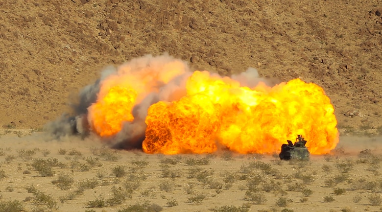 An Amphibious Assault Vehicle fires a Mine Clearing Line Charge from the Mark-154 Mod 1 Launcher at Range 114 aboard the Marine Corps Air Ground Combat Center, Twentynine Palms, Calif., Oct. 26, 2017. Unlike current amphibious breaching systems, the MICLIC will allow a breach lane that provides maneuverability for assault forces as they push forward to provide fire and maneuver on enemy defended beaches that are manned with explosives. (U.S. Marine Corps photo by Cpl. Christian Lopez)