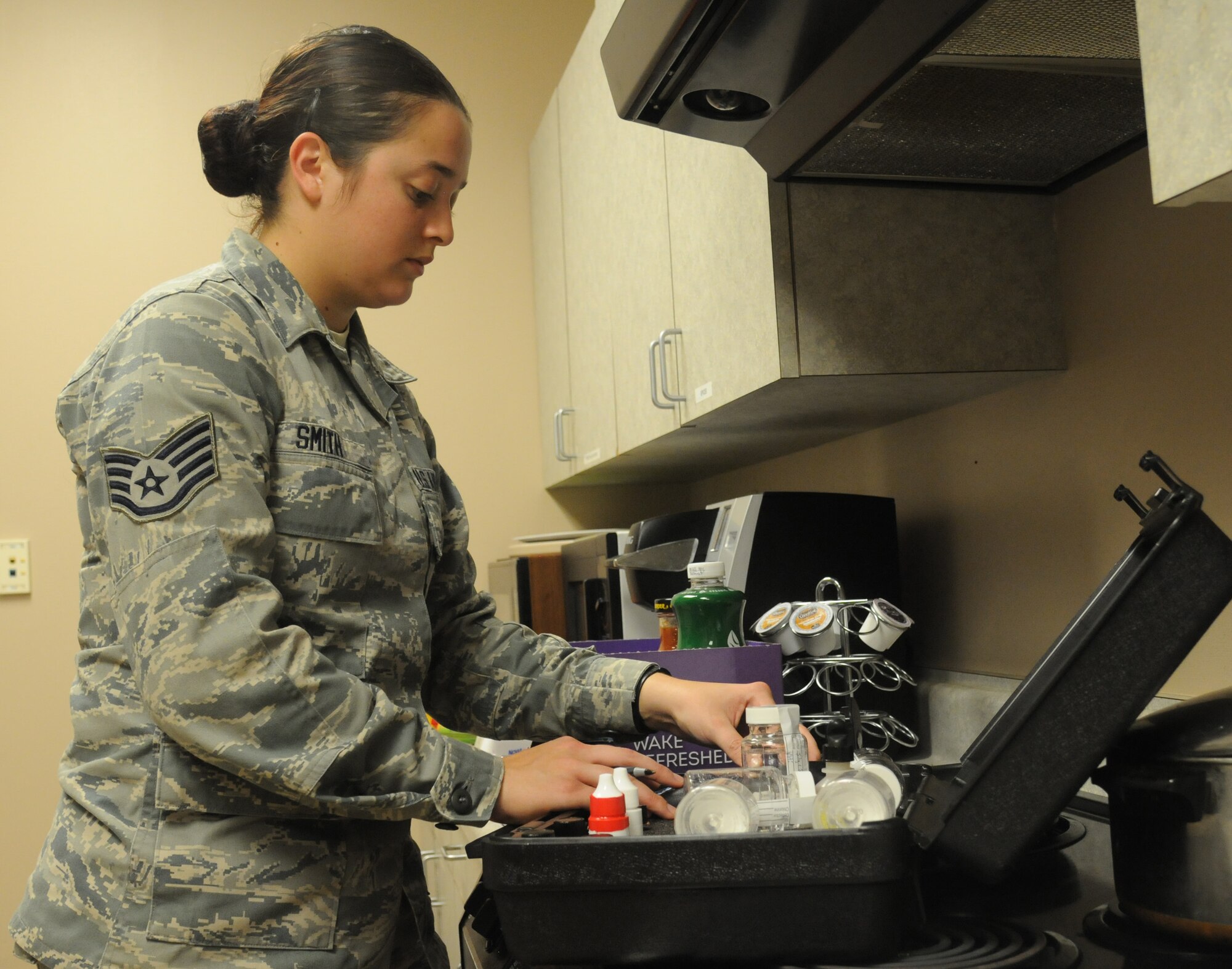 Staff Sgt. Tori Smith, 81st Aerospace Medicine Squadron environmental health NCO in charge, performs a water sample screening Nov. 2, 2017, on Keesler Air Force Base, Mississippi. The eight-man 81st AMDS Bioenvironmental team performs routine water checks, noise screenings, respiratory fit tests and ventilation tests along with HAZMAT emergency response to prevent occupational health hazards on Keesler AFB. (U.S. Air Force photo by Senior Airman Holly Mansfield)