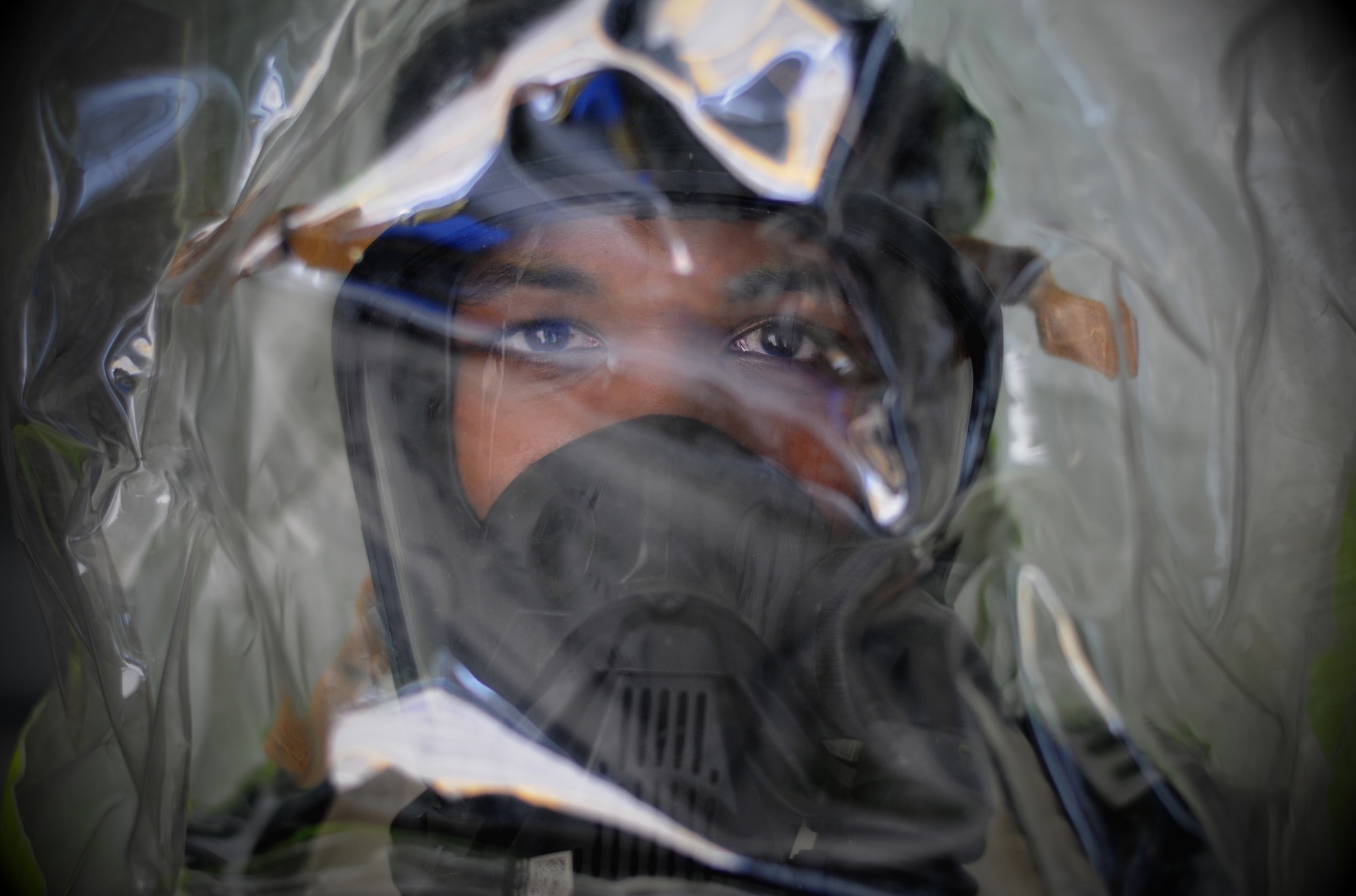 Senior Airman Devin Harris, 81st Aerospace Medicine Squadron bioengineering technician, poses for a photo wearing a hazardous material suit Nov. 1, 2017, on Keesler Air Force Base, Mississippi. The eight-man 81st AMDS Bioenvironmental team performs routine water checks, noise screenings, respiratory fit tests and ventilation tests along with HAZMAT emergency response to prevent occupational health hazards on Keesler AFB. (U.S. Air Force photo by Senior Airman Holly Mansfield)