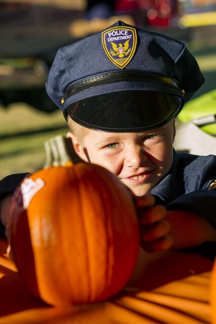 Logan Steele, son of Alan and Kathleen Steele, attend the annual Jack-O-Lantern Jubilee at Del Valle Field aboard the Marine Corps Air Ground Combat Center, Twentynine Palms, Calif., Oct. 27, 2017. The event was provided for members of the Combat Center community to enjoy as well as promote preventative services offered through the Behavioral Health Branch. (U.S. Marine Corps photo by Pfc. Rachel K. Young)