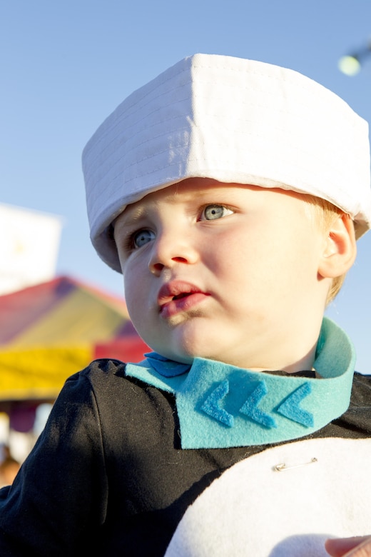 A child enjoys the festivities at the annual Jack-O-Lantern Jubilee at Del Valle Field aboard the Marine Corps Air Ground Combat Center, Twentynine Palms, Calif., Oct. 27, 2017. The event was provided for members of the Combat Center community to enjoy as well as promote preventative services offered through the Behavioral Health Branch. (U.S. Marine Corps photo by Pfc. Rachel K. Young)