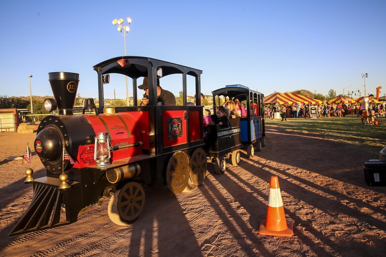 Patrons of the Marine Corps Air Ground Combat Center, Twentynine Palms, Calif., attend the annual Jack-O-Lantern Jubilee at Del Valle Field aboard the Combat Center, Oct. 27, 2017. The event was provided for members of the Combat Center community to enjoy as well as to promote preventative services offered through the Behavioral Health Branch. (U.S. Marine Corps photo by Lance Cpl. Margaret Gale)