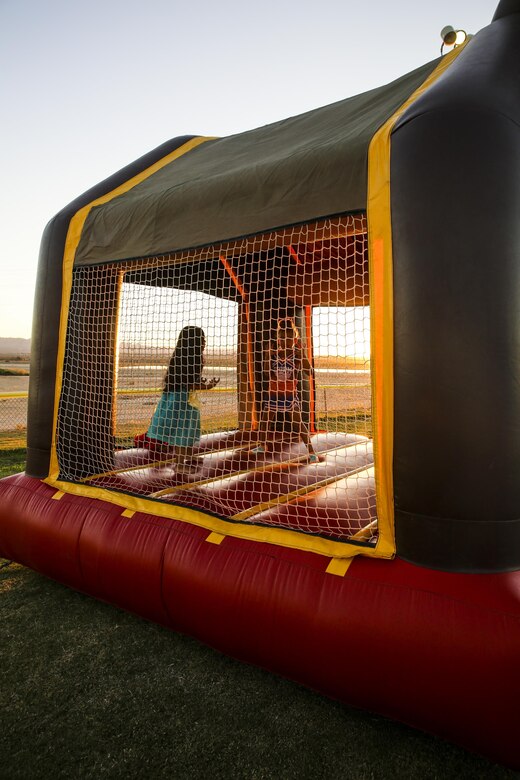 Patrons of the Marine Corps Air Ground Combat Center, Twentynine Palms, Calif., attend the annual Jack-O-Lantern Jubilee at Del Valle Field aboard the Combat Center, Oct. 27, 2017. The event was provided for members of the Combat Center community to enjoy as well as to promote preventative services offered through the Behavioral Health Branch. (U.S. Marine Corps photo by Lance Cpl. Margaret Gale)