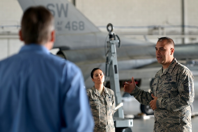 U.S Air Force Master Sgt. Christopher Benton, 20th Maintenance Group weapons academic instructor, speaks with members of the Shaw-Sumter Community Council (SSCC) during a tour at Shaw Air Force Base, South Carolina, Nov. 2, 2017.