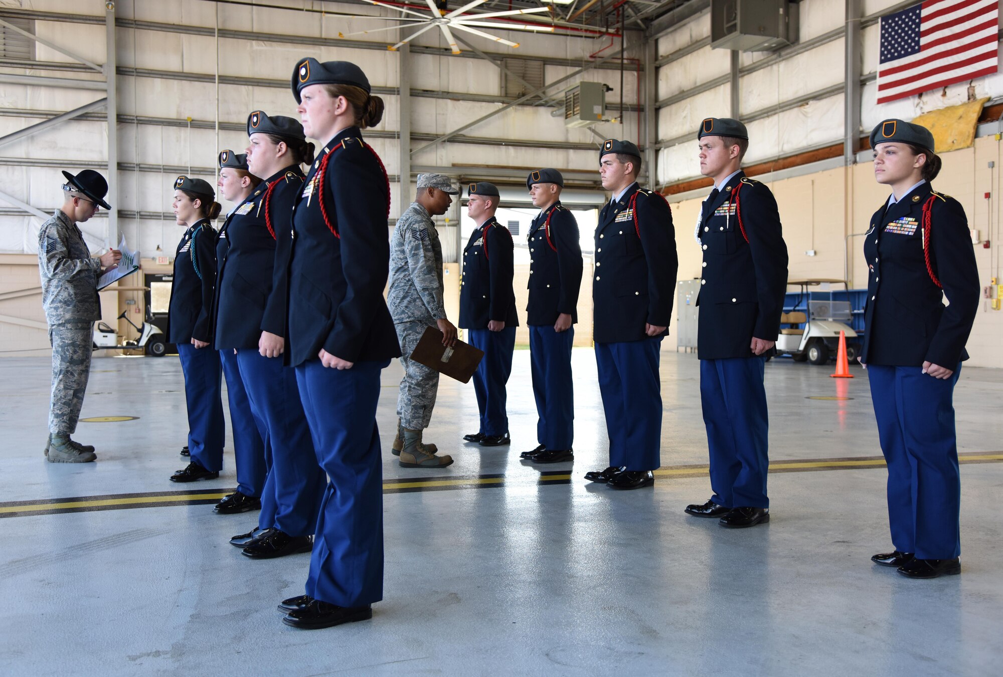 Master Sgt. James Correll, 2nd Air Force  military training instructor, and Tech. Sgt. Jonathan McElroy, 338th Training Squadron military training leader, judge Florence High School Army Junior ROTC during a personnel inspection at the Fourth Annual Mississippi All-Services Junior ROTC Drill Competition Nov. 4, 2017, on Keesler Air Force Base, Mississippi. More than 400 Junior ROTC cadets, spectators and volunteers were in attendance where cadets battled for the best all-services Junior ROTC team in Mississippi. Thirteen Junior ROTC teams from all military branches were represented at the event with the Pearl High School Navy Junior ROTC earning the top honors. (U.S. Air Force photo by Kemberly Groue)