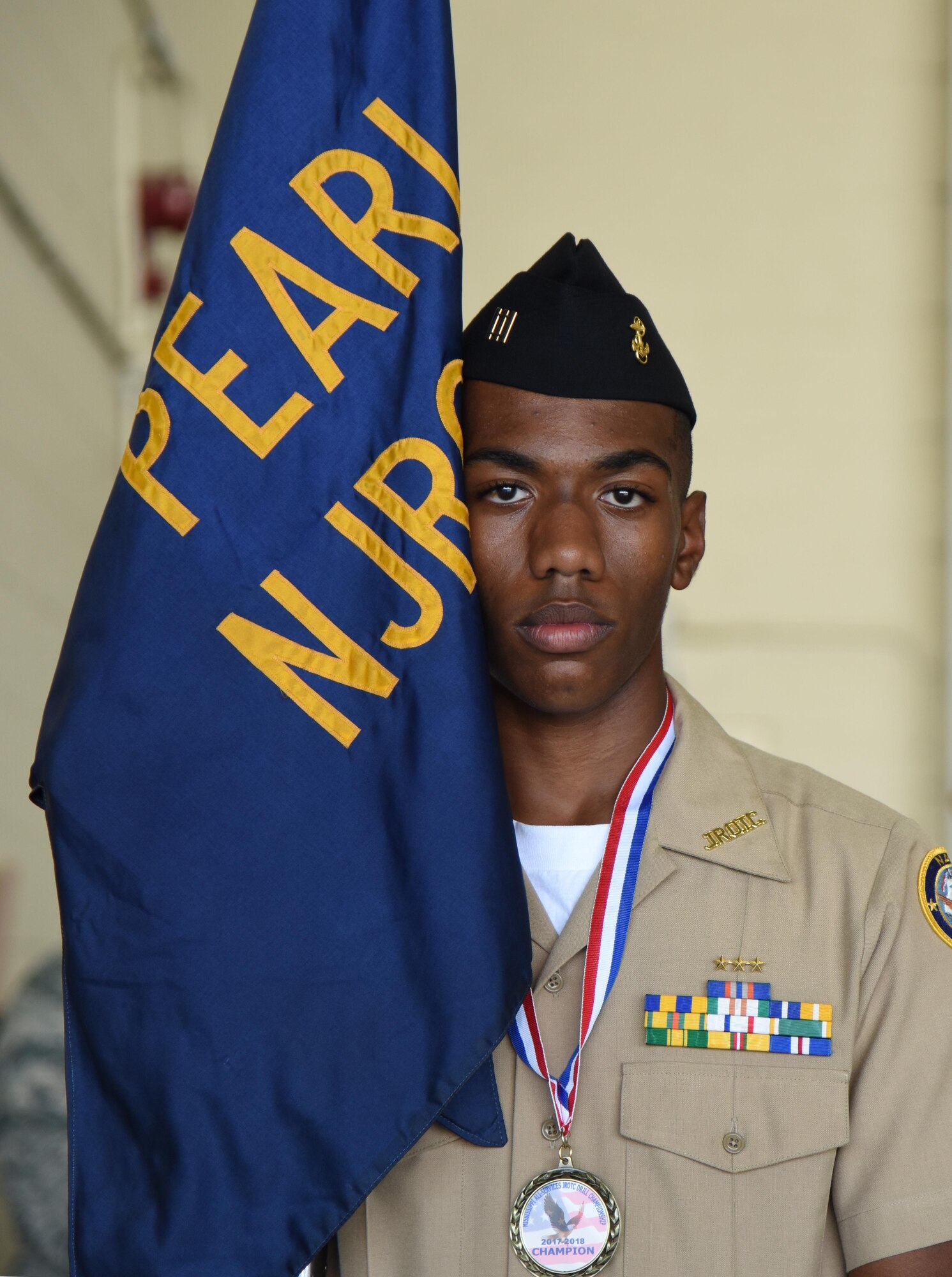 Jalen Houseworth, Pearl High School Navy Junior ROTC  posts the guidon during the Fourth Annual Mississippi All-Services Junior ROTC Drill Competition Nov. 4, 2017, on Keesler Air Force Base, Mississippi. More than 400 Junior ROTC cadets, spectators and volunteers were in attendance where cadets battled for the best all-services Junior ROTC team in Mississippi. Thirteen Junior ROTC teams from all military branches were represented at the event with the Pearl High School Navy Junior ROTC earning the top honors. (U.S. Air Force photo by Kemberly Groue)