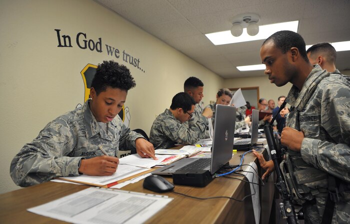 9th Force Support Squadron personnel out-process a group of Airmen during Global Thunder 18