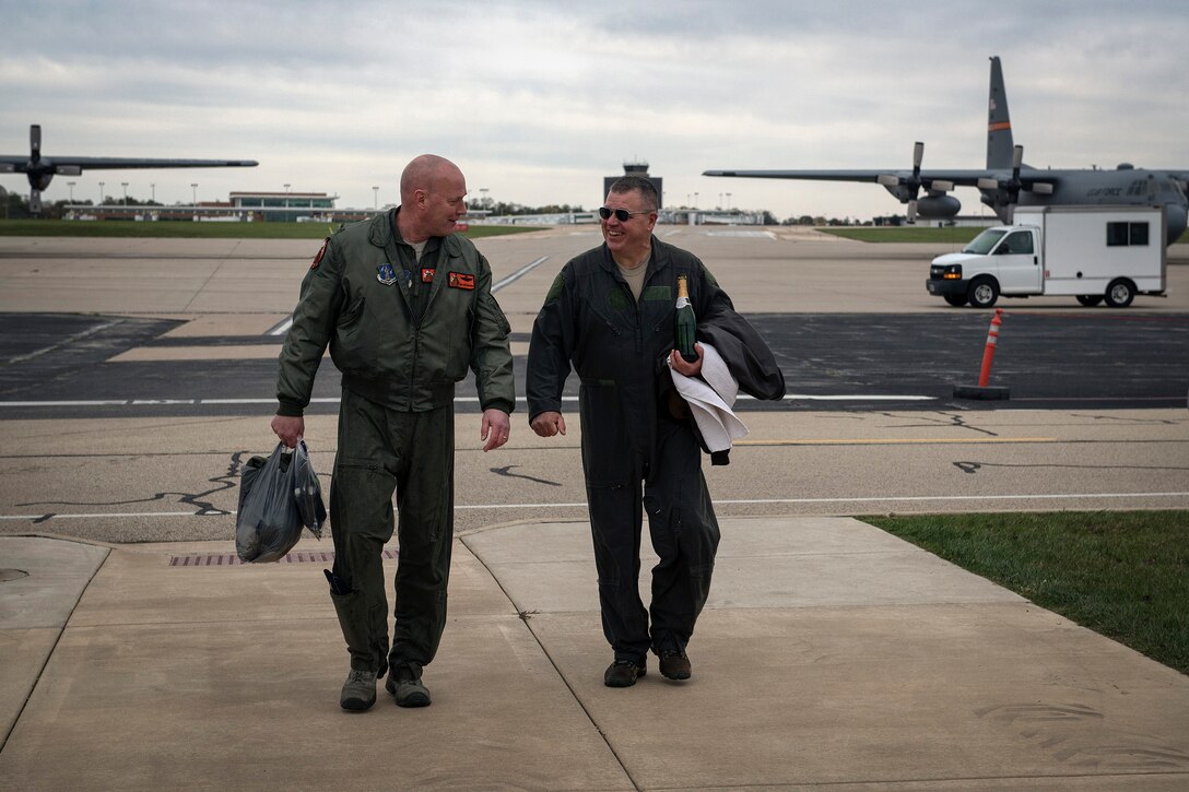 U.S. Air Force Col. Daniel McDonough, left, the commander of the 182nd Operations Group, Illinois Air National Guard, walks with 182nd Airlift Wing commander Col. William Robertson after Robertson’s final C-130 Hercules flight in Peoria, Ill., Oct. 31, 2017. McDonough is slated to become the next wing commander upon Robertson’s appointment to chief of staff of the Illinois Air National Guard in November 2017. (U.S. Air National Guard photo by Tech. Sgt. Lealan Buehrer)