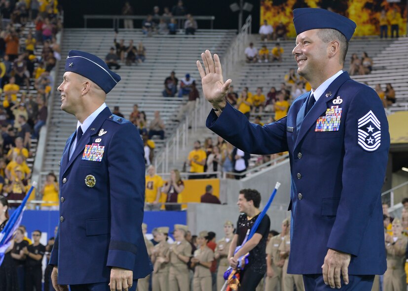 Brig. Gen. Brook Leonard, 56th Fighter Wing commander, and Chief Master Sgt. Randy Kwiatkowski, 56th FW command chief, are recognized during Arizona State University’s annual Salute to Service football game in Tempe, Ariz., Nov. 4, 2017. The Salute to Service initiative honors military members past and present for their sacrifices to our country by hosting service themed events. (U.S. Air Force photo/Senior Airman Devante Williams)