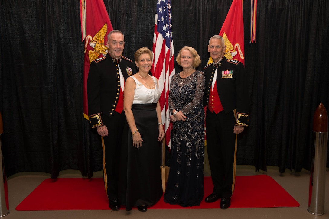 Gen. Joseph F. Dunford Jr. (far left), the chairman of Joint Chiefs of Staff, and Lt. Gen. Rex C. McMillian (far right), commander of Marine Forces Reserve and Marine Forces North, along with Ellyn Dunford and Rebecca McMillian pose for a photo at the Mercedes Benz Superdome in New Orleans, Nov. 3, 2017.