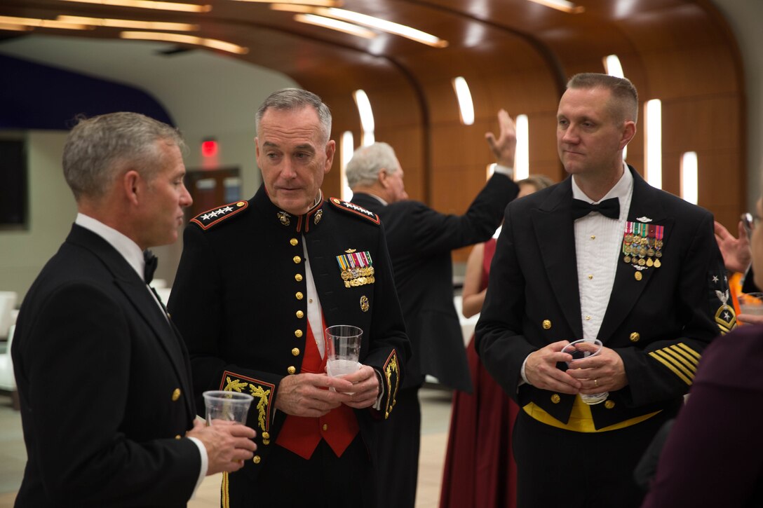 Gen. Joseph F. Dunford Jr. (middle), the chairman of Joint Chiefs of Staff, speaks to Master Chief Matthew Downing (right), command Master Chief of 4th Marine Division and Master Chief Ryan Strack (right), the command Master Chief of Marine Forces Reserve and Marine Forces North, at the 242nd Marine Corps Birthday Ball hosted by Marine Forces Reserve, at the Mercedes Benz Superdome, in New Orleans, Nov. 3, 2017.